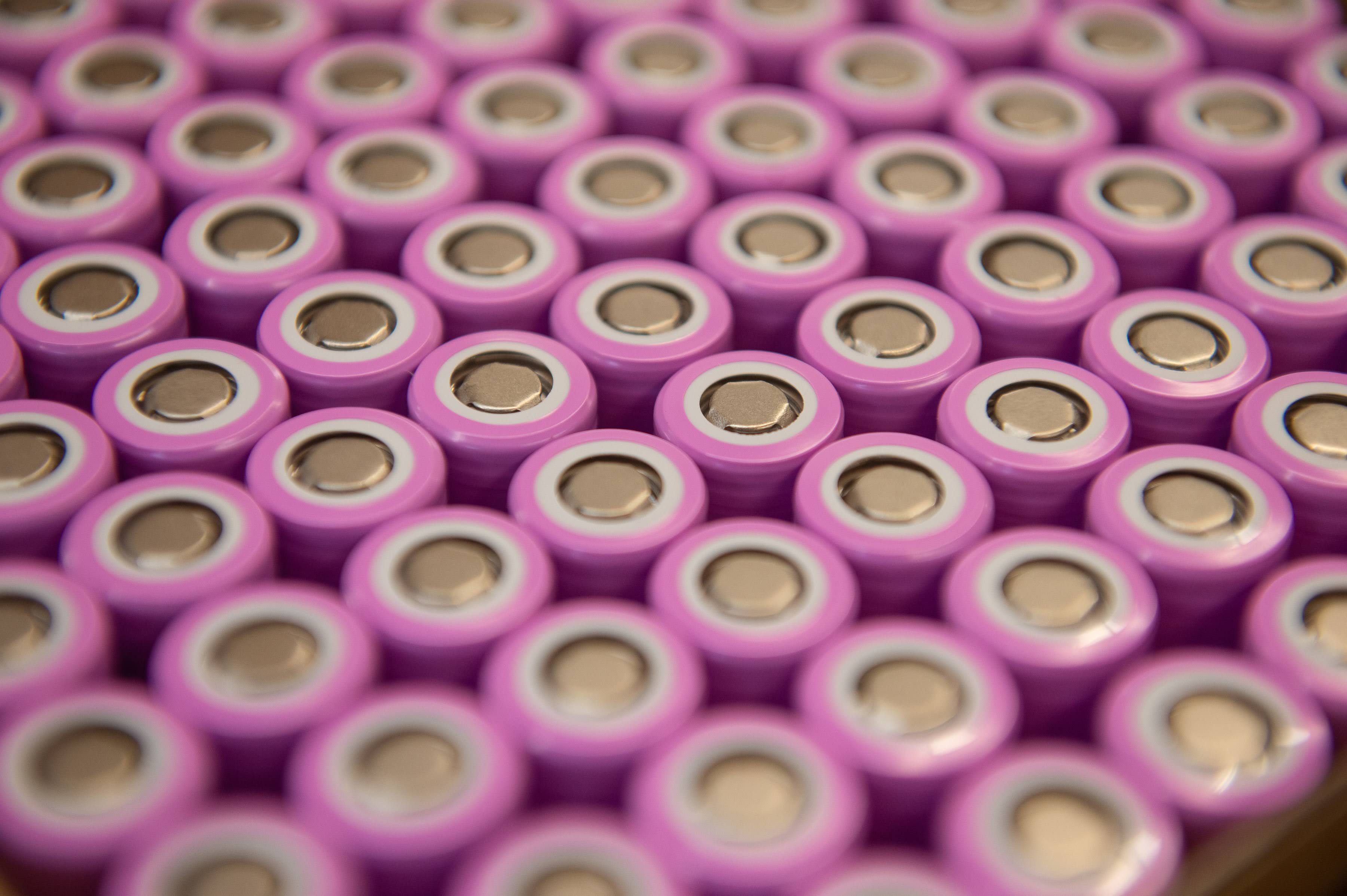 A group of purple coloured battery cells